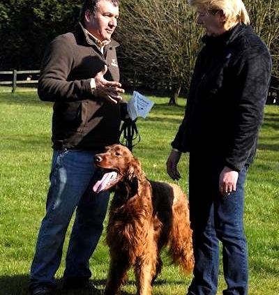 Installer giving dog fence safety tips to a customer