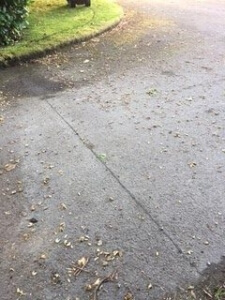Tarmac driveway with cut for wire buried and sealed 